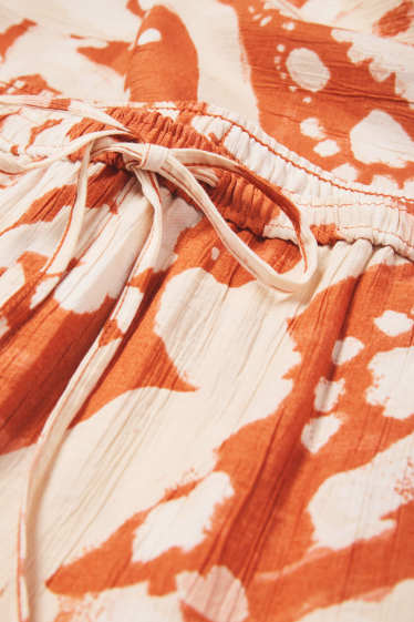 Women - Cloth trousers - mid-rise waist - palazzo - patterned - dark orange
