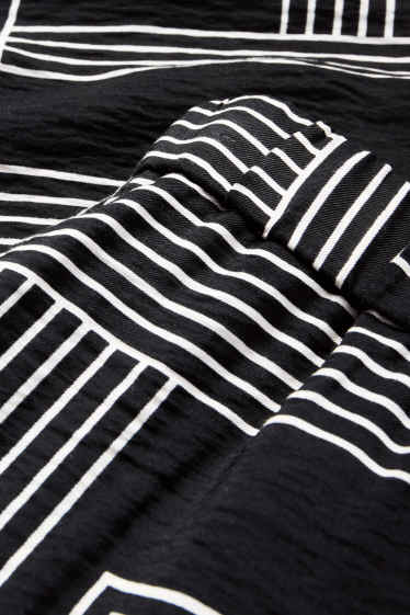 Women - Cloth trousers - high waist - wide leg - patterned - black / white