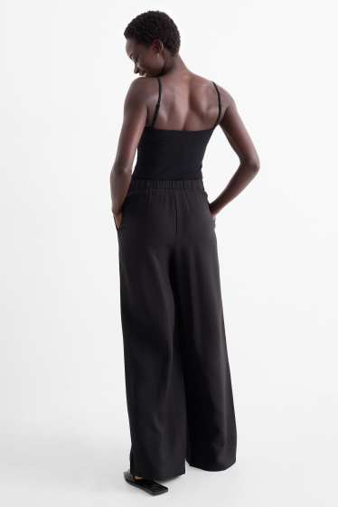 Women - Cloth trousers - high waist - wide leg - black