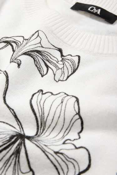 Femmes - Pull en maille - manches courtes - à fleurs - blanc / noir