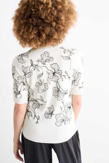 Femmes - Pull en maille - manches courtes - à fleurs - blanc / noir