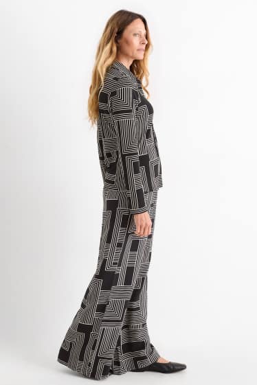 Women - Cloth trousers - high waist - wide leg - patterned - black / white