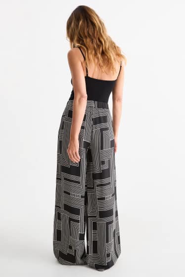 Women - Cloth trousers - high waist - wide leg - patterned - black / white