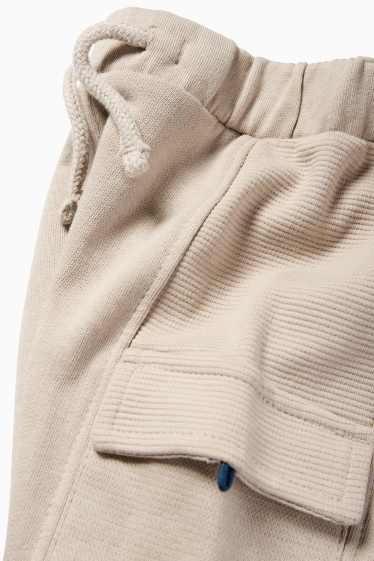 Bebeluși - băieți - Pantaloni de trening bebeluși - model cargo - bej