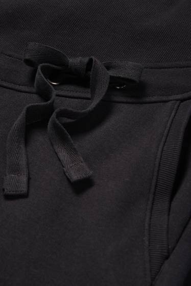 Damen - Umstands-Jogginghose - schwarz