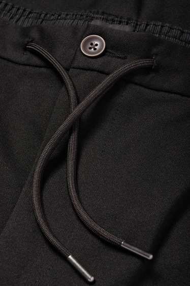 Uomo - Pantaloni chino - tapered fit - nero