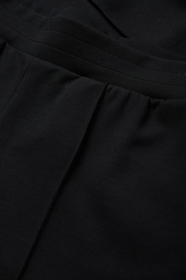 Dámské - Žerzejové kalhoty basic - mid waist - straight fit - černá