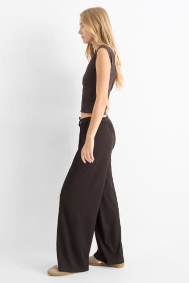 Dames - Broek van jersey - mid waist - wide leg - met structuur - donkerbruin