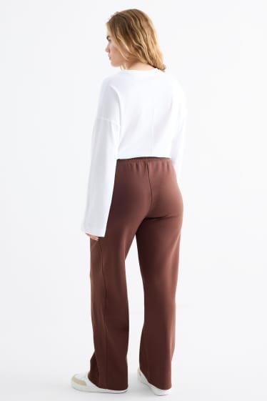 Dona - Pantalons de xandall - marró fosc