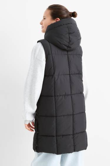 Kinderen: meisjes - Lange bodywarmer met capuchon - waterafstotend - zwart