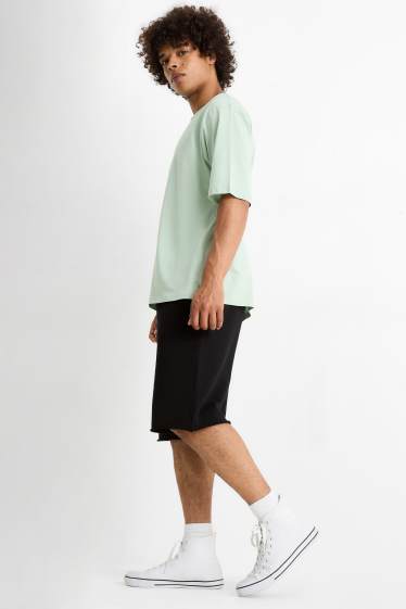 Bărbați - Pantaloni scurți de trening - negru
