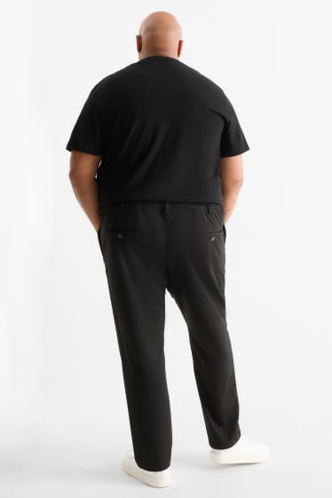 Uomo - Pantaloni chino - tapered fit - nero
