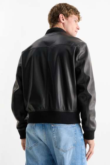 Hommes - Blouson - matière synthétique - noir