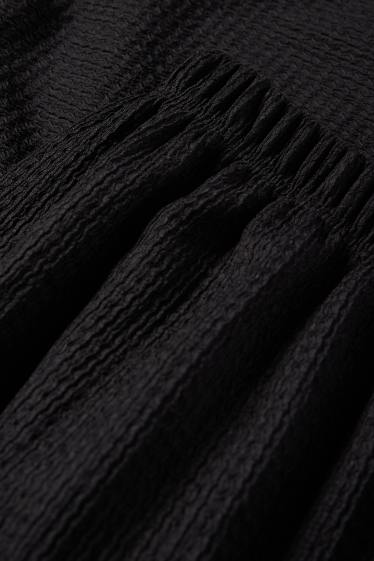 Dámské - Žerzejové kalhoty - mid waist - wide leg - strukturované - černá