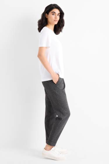 Dámské - Žerzejové kalhoty - mid waist - tapered fit - strukturované - tmavošedá