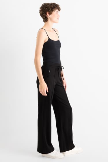 Dámské - Žerzejové kalhoty - mid waist - straight fit - černá