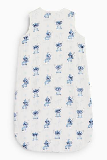 Baby: jongens - Lilo & Stitch - babyslaapzak - 6 tot 9 maanden - wit