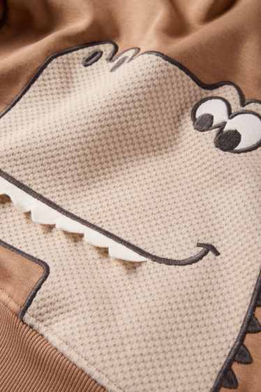 Děti - chlapci - Motiv dinosaura - mikina s kapucí - světle hnědá