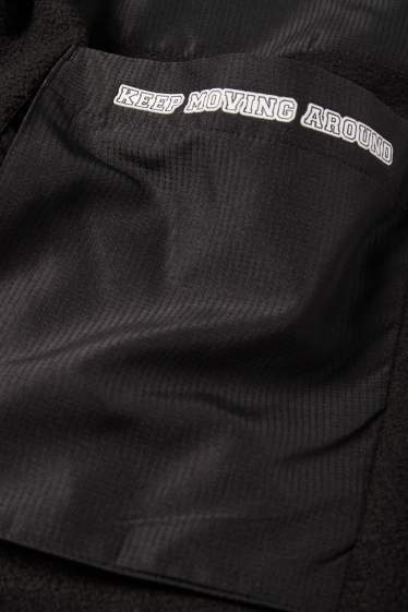 Nen - Pantalons de xandall cargo de teixit polar - negre