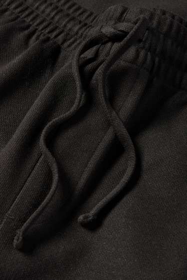 Uomo - Pantaloni sportivi - nero