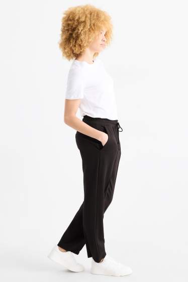 Femei - Pantaloni din jerseu - talie medie - tapered fit - negru
