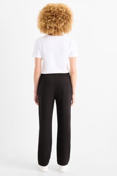 Femei - Pantaloni din jerseu - talie medie - tapered fit - negru