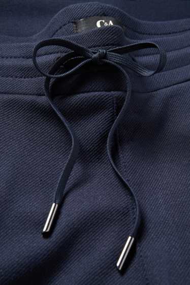 Dámské - Žerzejové kalhoty - mid waist - tapered fit - tmavomodrá