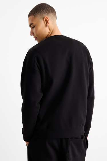 Home - Dessuadora - negre