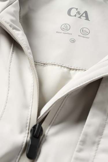 Dona - Jaqueta amb caputxa - folrada - impermeable - blanc neu