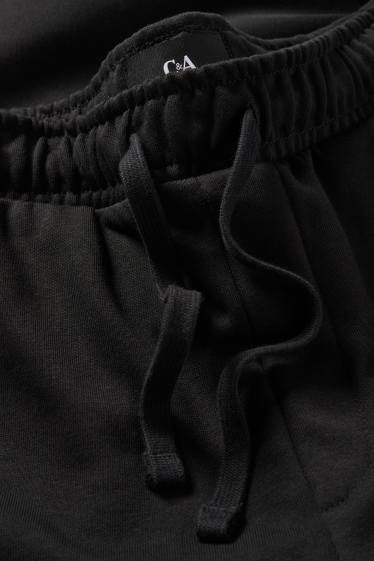 Pánské - Teplákové kalhoty - černá