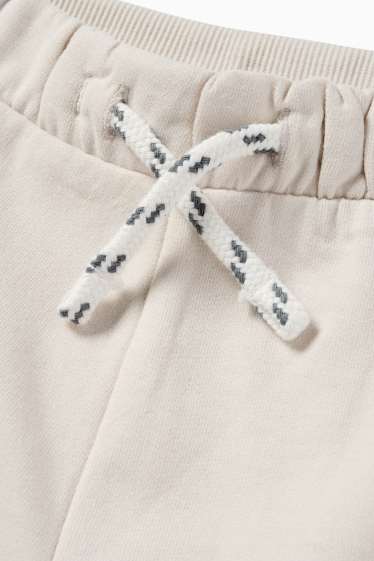 Miminka - chlapci - Cargo teplákové kalhoty pro miminka - světle béžová