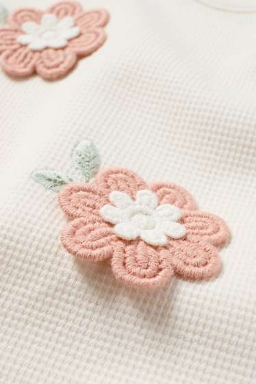 Nadó nena - Floretes - dessuadora per a nadó - texturada - crema