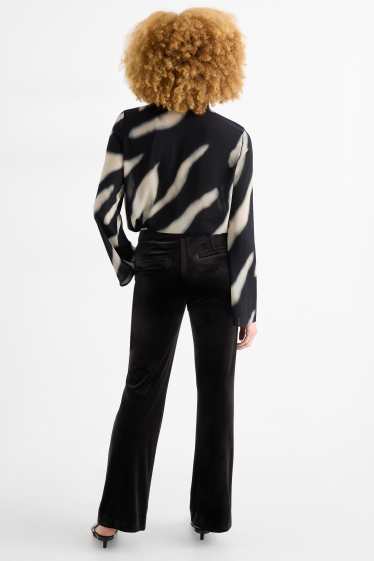 Dames - Fluwelen broek - high waist - flared - zwart