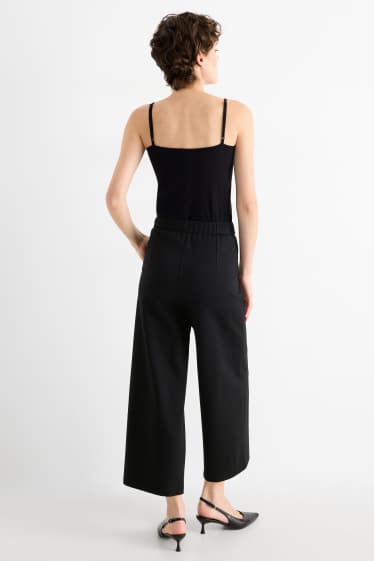 Dámské - Žerzejové kalhoty s páskem - high waist - wide leg - černá