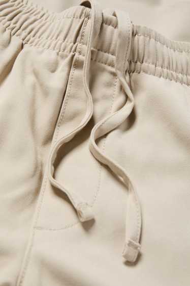 Home - Xinos - tapered fit - beix clar