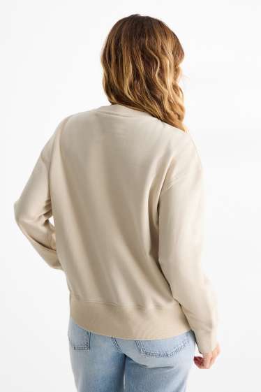 Dona - Dessuadora amb pedres d’estràs - beix