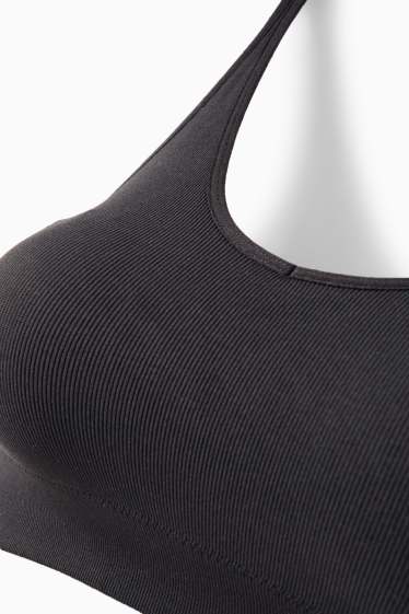 Damen - Sport-BH - wattiert - gerippt - seamless - schwarz