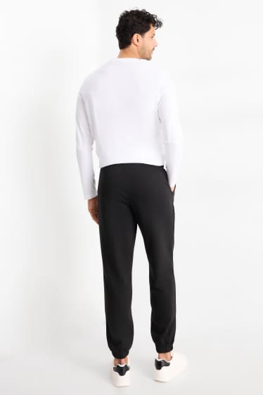 Uomo - Pantaloni sportivi - nero