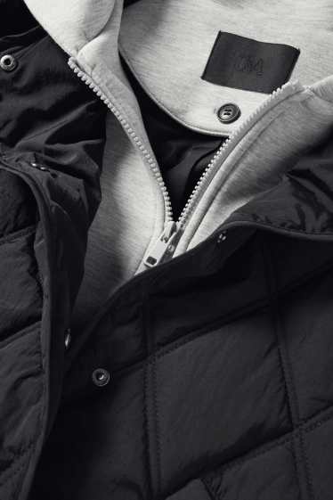 Damen - Steppjacke mit Kapuze - schwarz