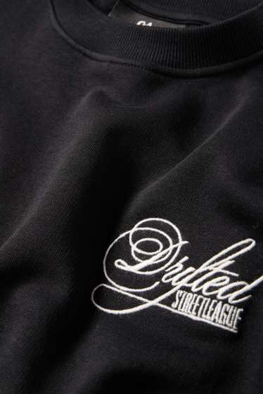 Home - Dessuadora oversized - negre