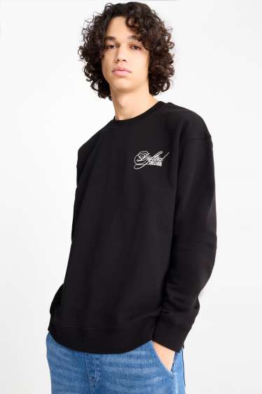 Home - Dessuadora oversized - negre