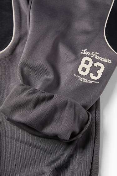 Děti - chlapci - Teplákové kalhoty - černá/tmavošedá