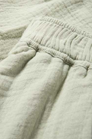 Damen - Umstands-Musselin-Shorts - hellgrün