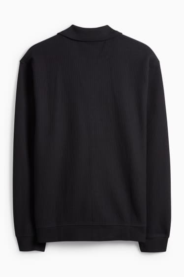 Hommes - Polo à manches longues - en maille - relaxed fit - finition côtelée - noir