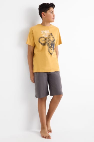 Kinderen: jongens - BMX - set - T-shirt en shorts - 2-delig - licht oranje