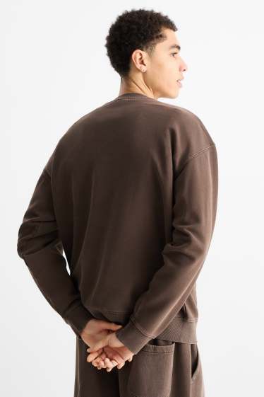 Home - Dessuadora oversized - marró