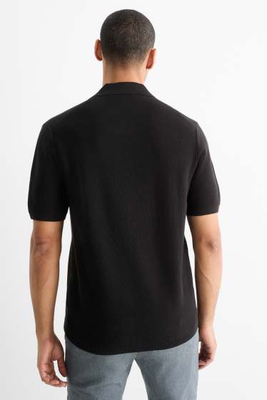 Uomo - Polo in maglia - regular fit - tessuto tramato - nero