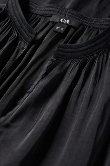 Dona - Brusa amb el coll en punta - negre