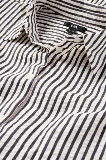 Dona - Brusa - de ratlles - negre/beix