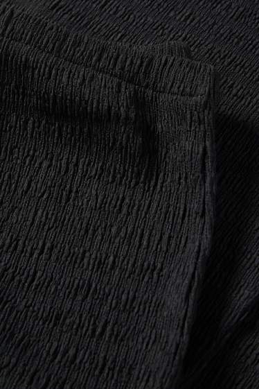 Damen - Flared Leggings - strukturiert - schwarz